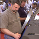 Machete enthusiasts examine new models at the Southwest Machete Expo in Tucson, AZ.